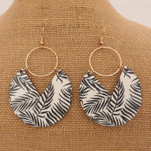 Load image into Gallery viewer, Black Leaves on Cream Wood & Gold Tone Drop Earrings