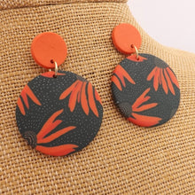 Load image into Gallery viewer, Orange Flower on Black, Round Polymer Stud Drop Earrings