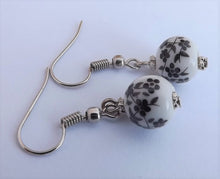 Load image into Gallery viewer, Small Black Flowers on White, Ceramic Look Bead Earrings