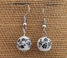 Load image into Gallery viewer, Small Black Flowers on White, Ceramic Look Bead Earrings