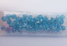 Load image into Gallery viewer, Strand Light Blue AB Lustre Glass Bicone 4mm Beads
