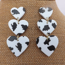 Load image into Gallery viewer, Black &amp; White Triple Heart Acrylic Drop Earrings
