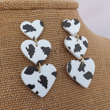 Load image into Gallery viewer, Black &amp; White Triple Heart Acrylic Drop Earrings
