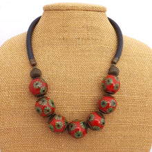 Load image into Gallery viewer, Green Flowers on Red Ceramic Bead Necklace
