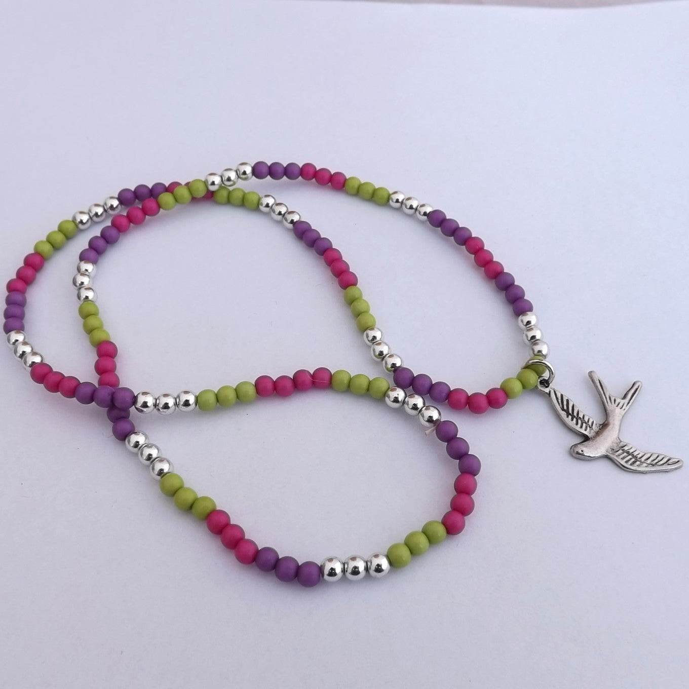 Green, Purple Pink Bead Necklace with Flying Bird Pendant