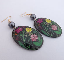 Load image into Gallery viewer, Pink, Yellow &amp; Green Flowers on Black Large Oval Acrylic &amp; Bead Drop Earrings
