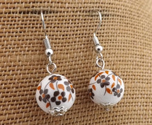 Load image into Gallery viewer, Brown Flowers on White Bead Earrings
