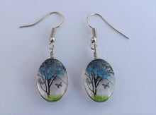 Load image into Gallery viewer, Clear Glass Oval Drop Earrings with Light Blue Tree &amp; Butterflies Inside
