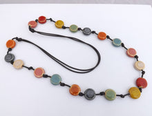 Load image into Gallery viewer, Flat Round Ceramic Pottery Beads on Black Cord Necklace
