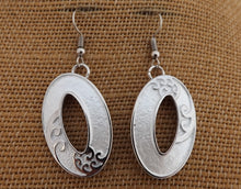 Load image into Gallery viewer, Frosted White &amp; Silver Tone Hollowed Oval Drop Earrings with Ponga Frond Detail
