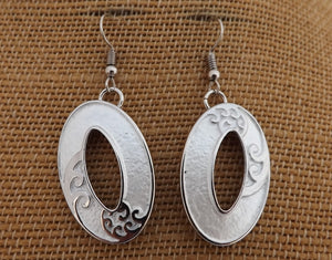 Frosted White & Silver Tone Hollowed Oval Drop Earrings with Ponga Frond Detail