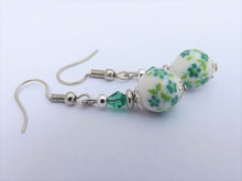 Load image into Gallery viewer, Green Flowers on White Bead Earrings
