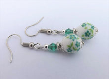 Load image into Gallery viewer, Green Flowers on White Bead Earrings
