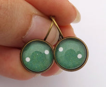 Load image into Gallery viewer, White Dots on Green - Bronze Dome Earrings - Bronze Tone Dome Earrings on Lever Back Hooks
