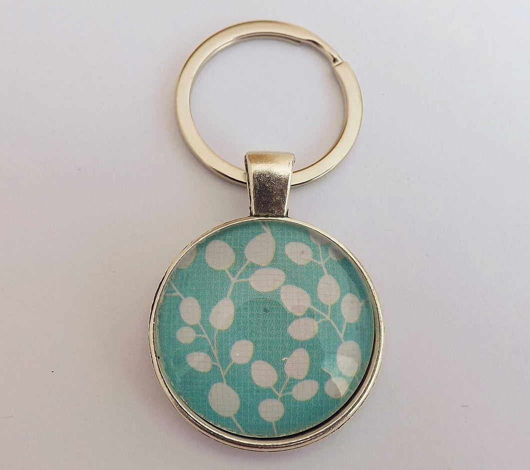 White Leaves on Blue  - Silver Tone Dome Key Ring